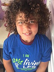 Honored Kid Lily with curly hair