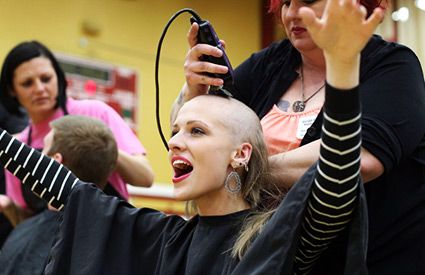 Woman having her head shaved