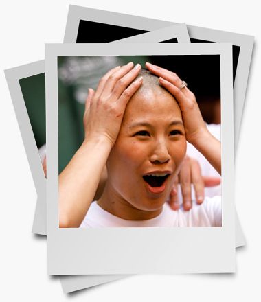 Young woman reacting with joy to her shaved head